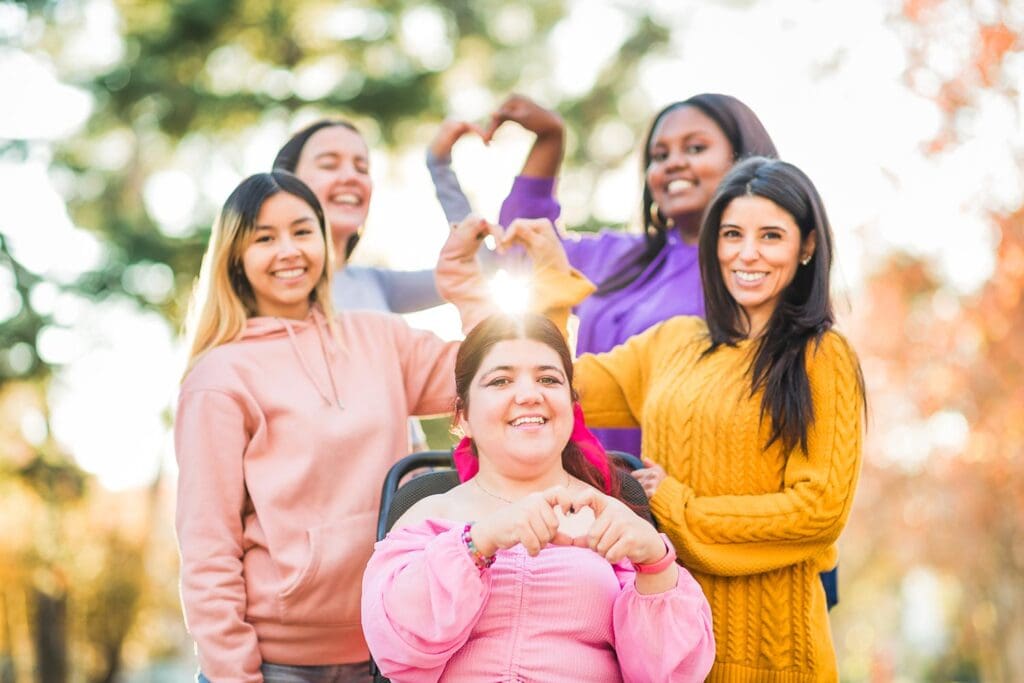 Diverse group of women together, smiling and celebrating inclusion and solidarity.