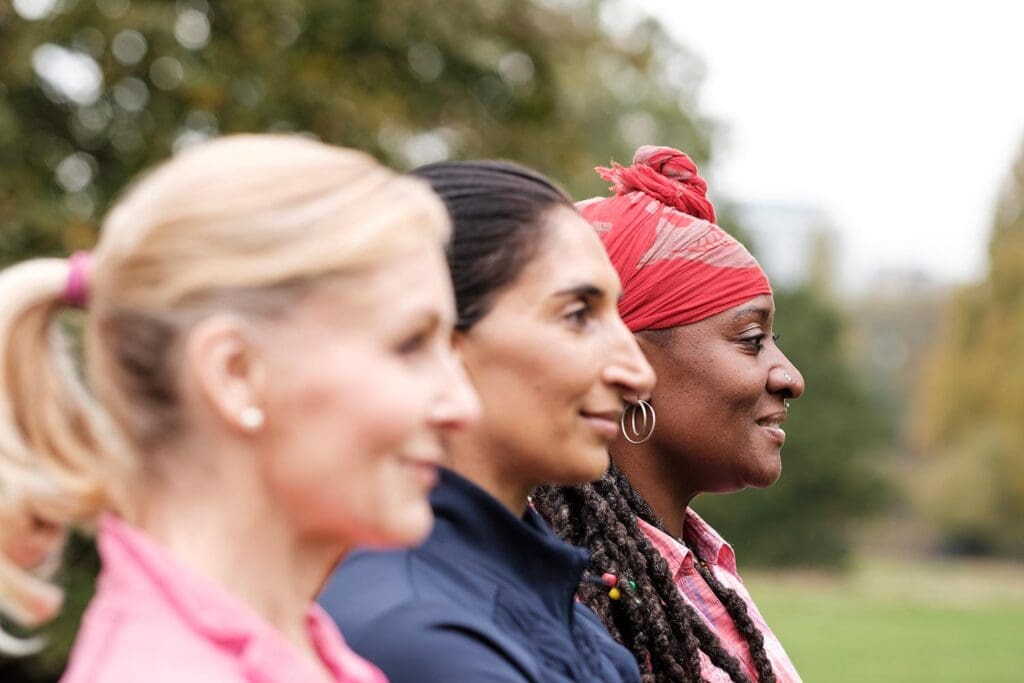 Group of older women exercising together, side view